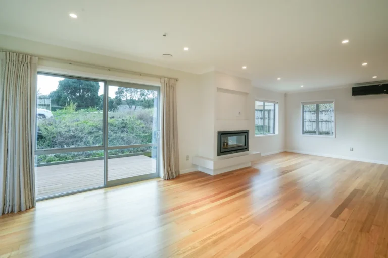 Lounge with timber floors, Two brick homes, Ellerslie