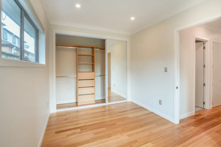 Wardrobe with custom cabinetry, Two brick homes, Ellerslie