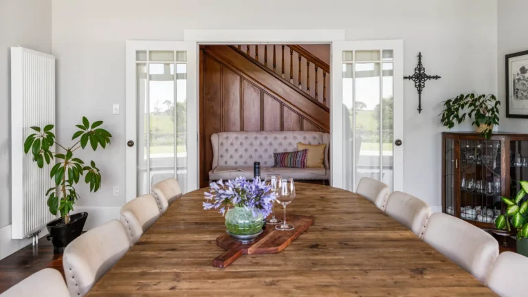 Dining table looking to the staircase, The Huntly House, Clarks Beach