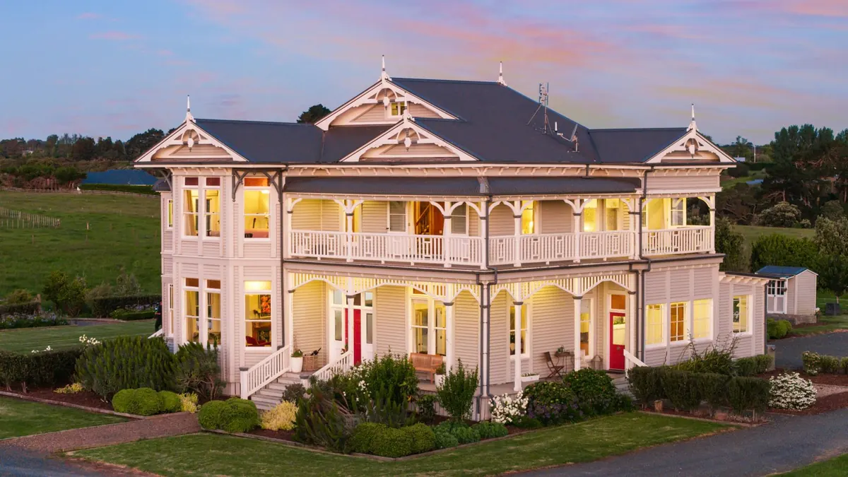 The Huntly House, Clarks Beach at dusk