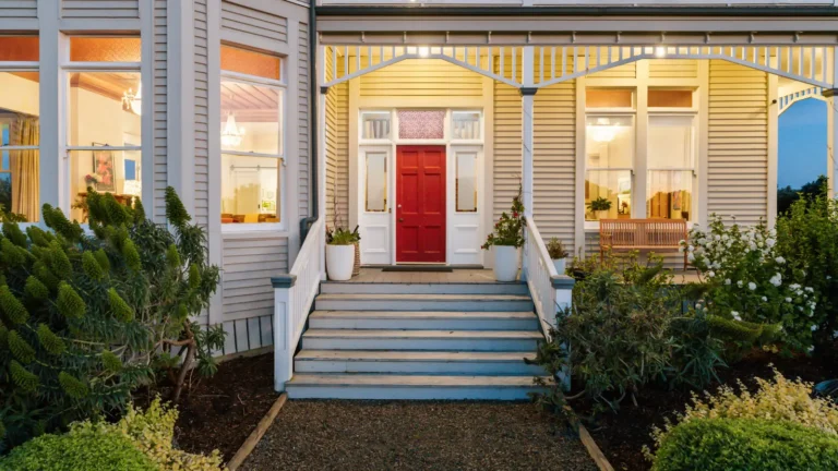 Front door and steps at dusk, The Huntly House, Clarks Beach