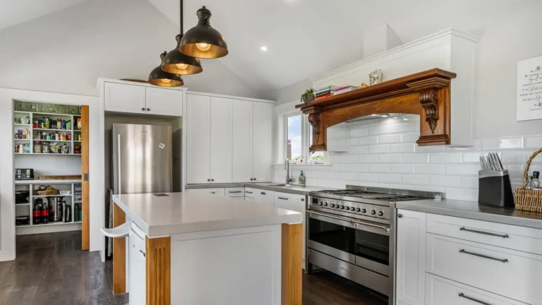 Kitchen with range and timber mantel, The Huntly House, Clarks Beach