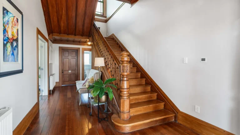 Sweeping timber staircase, The Huntly House, Clarks Beach