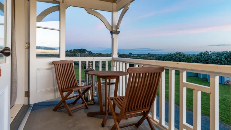 Upstairs verandah at dusk, The Huntly House, Clarks Beach