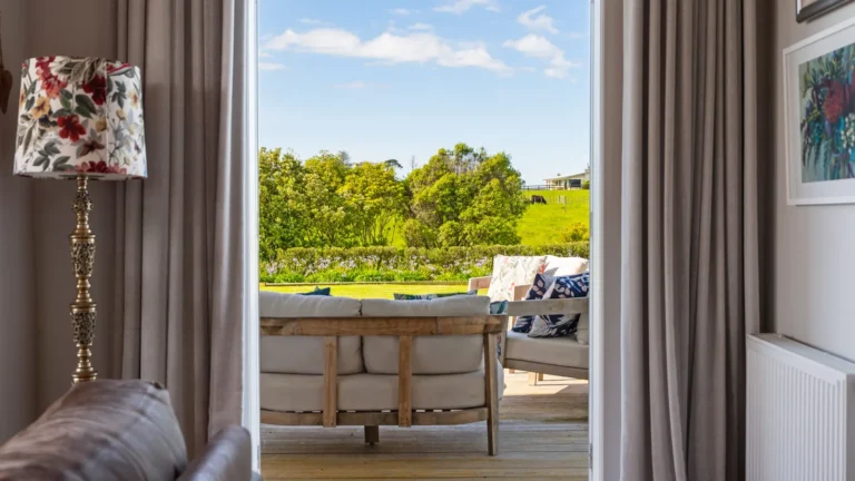 View from the lounge to the deck, The Huntly House, Clarks Beach