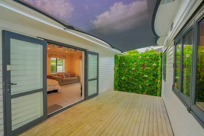 New deck outside a bedroom with sliding doors